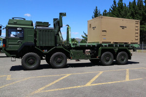 Small size container on flatrack loaded onto truck